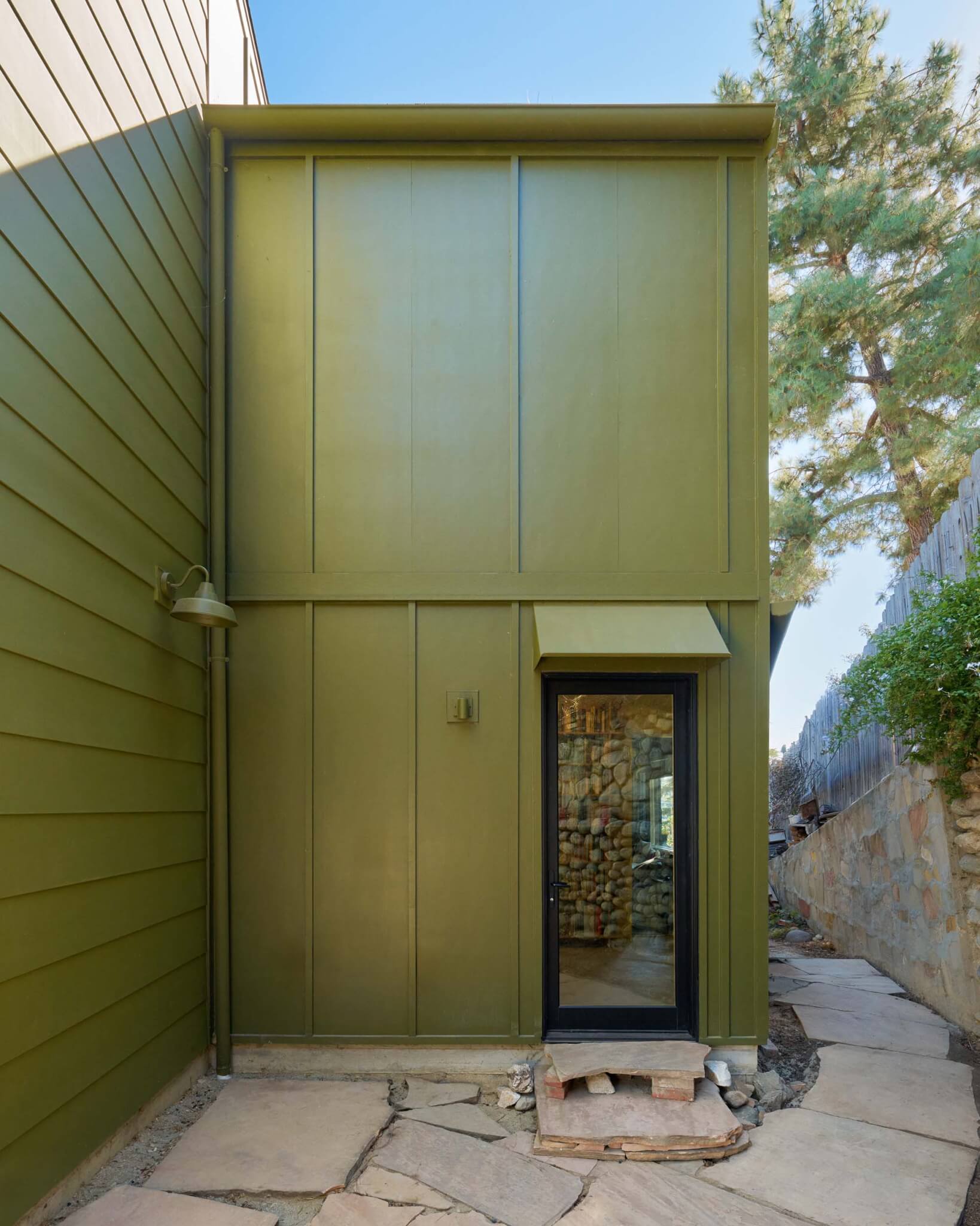yellow green painted shingles of house