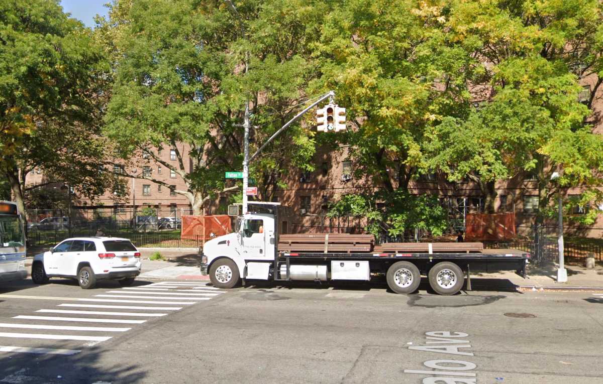Teenage boy shot in Brooklyn apartment building; shooting suspect at large 2 Scene of Brooklyn shooting - apartment building with truck in front of it