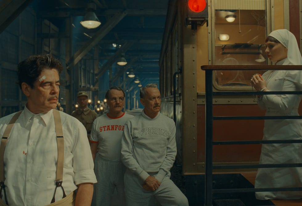 (l to r) benicio del toro as zsa zsa korda, bryan cranston as reagan, tom hanks as leland, and mia threapleton as liesl in director wes anderson's the phoenician scheme, a focus features release. credit: courtesy of tps productions/focus features © 2025 all rights reserved.