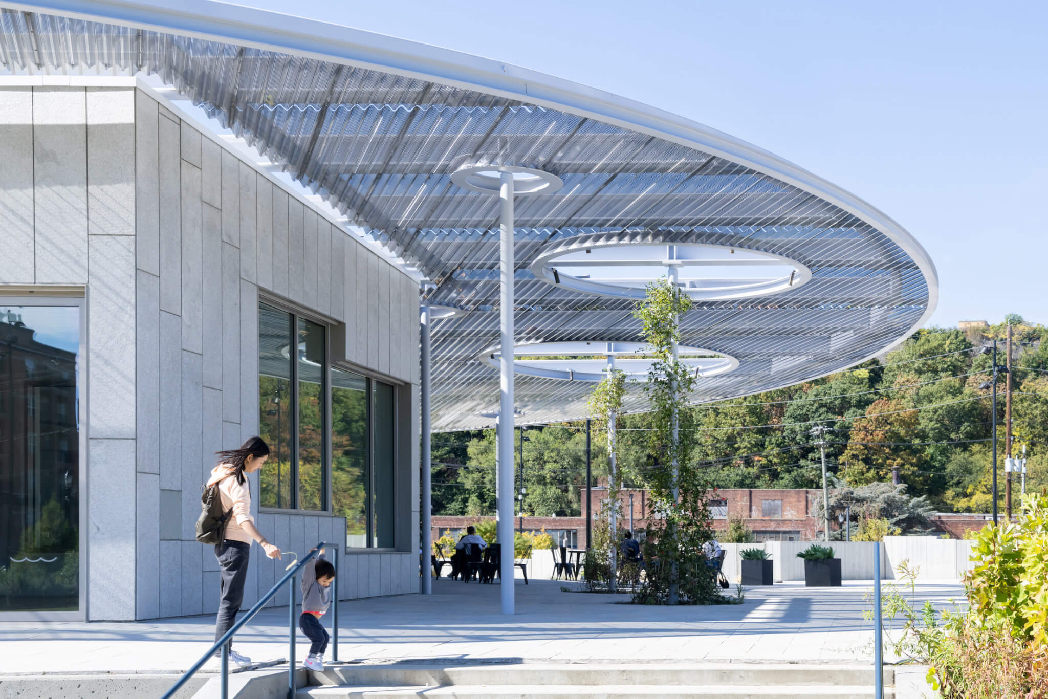 An exterior photo of the ResilienCity Park cafe and outdoor patio under the pavilon