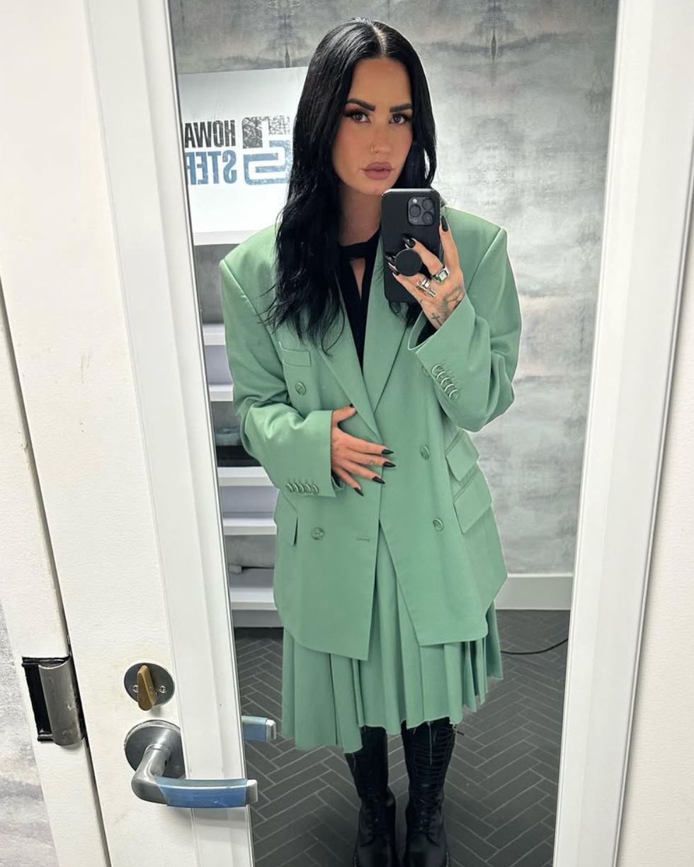 demi lovato taking a picture of herself in a mirror