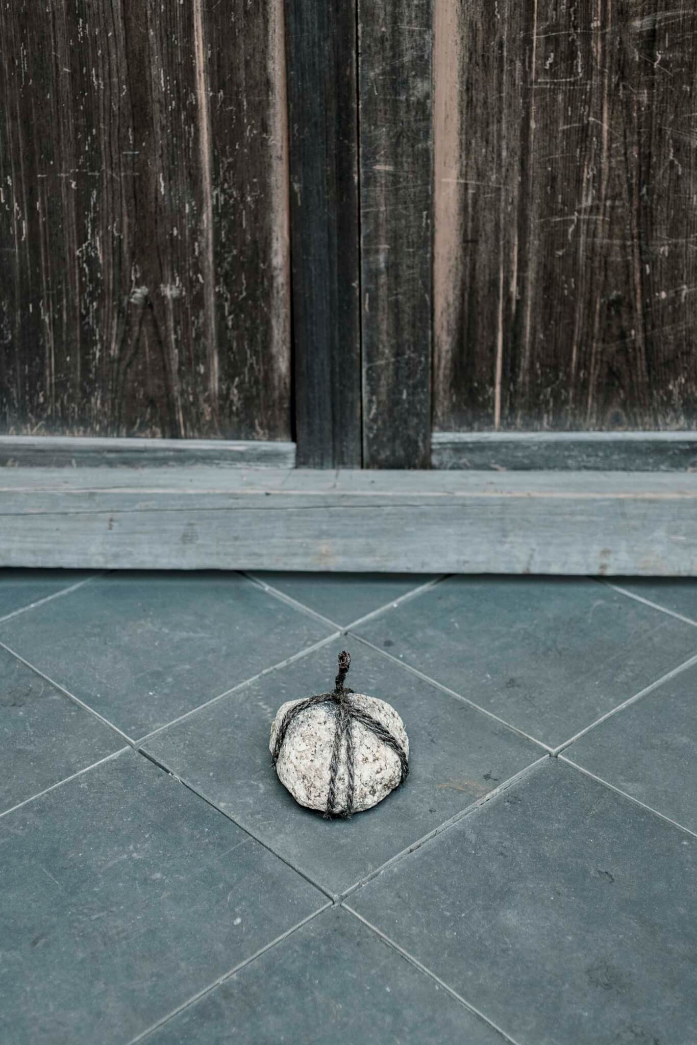 stone on blue tile