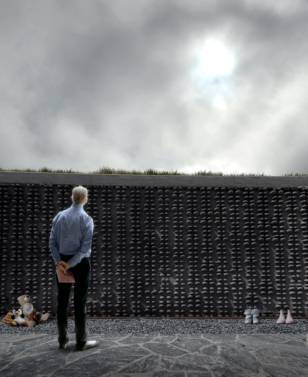 Rendering of the wall memorial that has casts of children's shoes 
