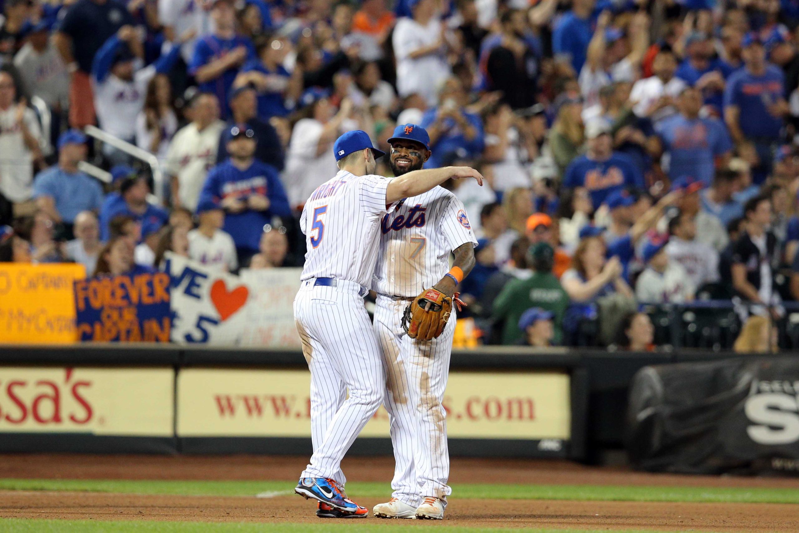 David Wright Jose Reyes: Man in baseball uniform #5 hugs man in baseball uniform