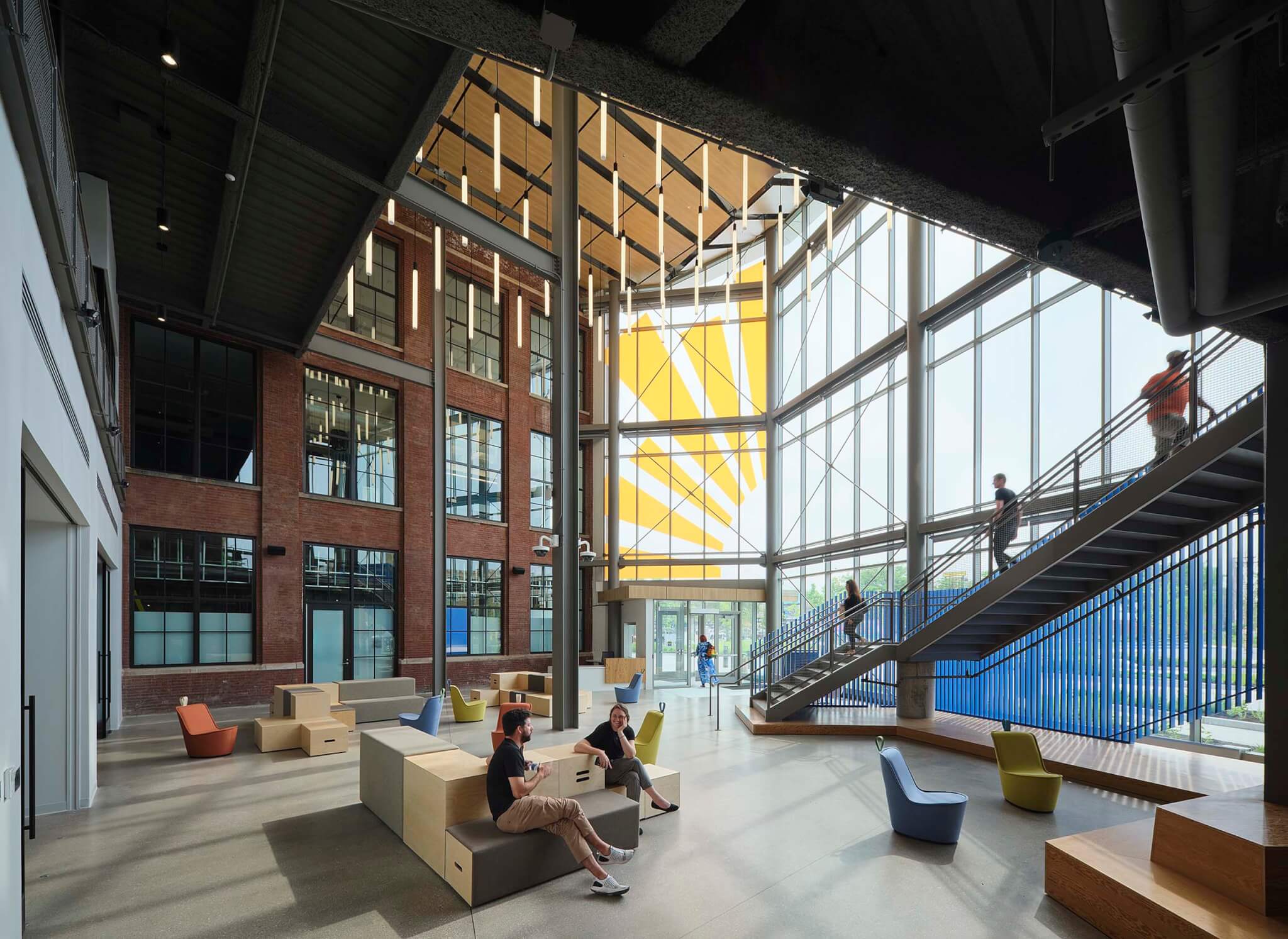 An orange sunburst vinyl decal stretches along the atrium’s corner