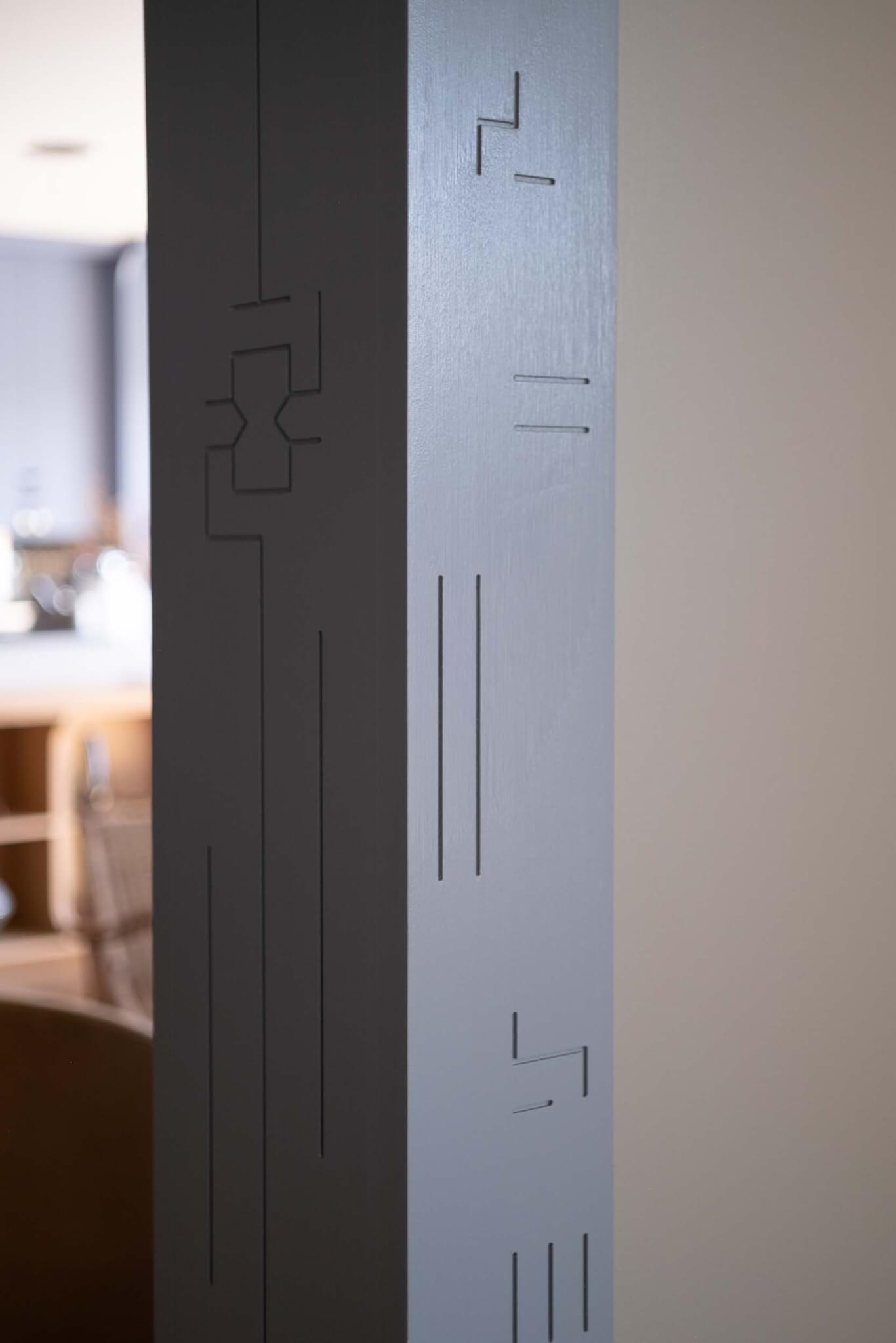 etched motifs in column