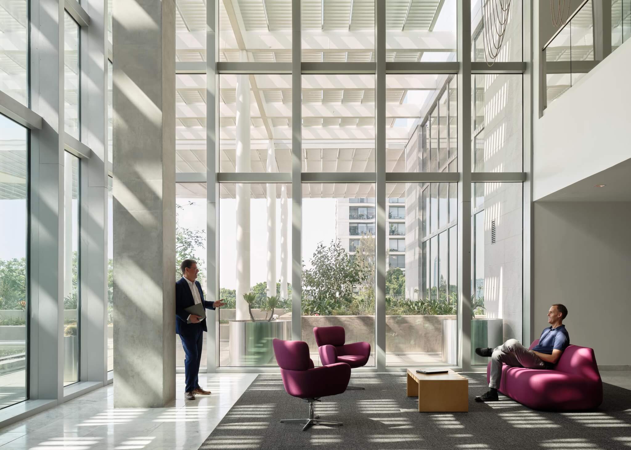 Interior, glass facade, shading structure filters sunlight