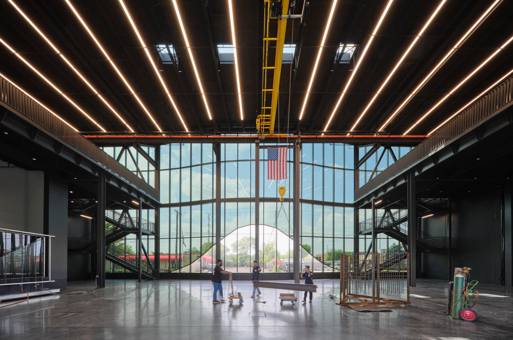 LED light strips, exposed window wall and steel backup system, open interior, concrete floor