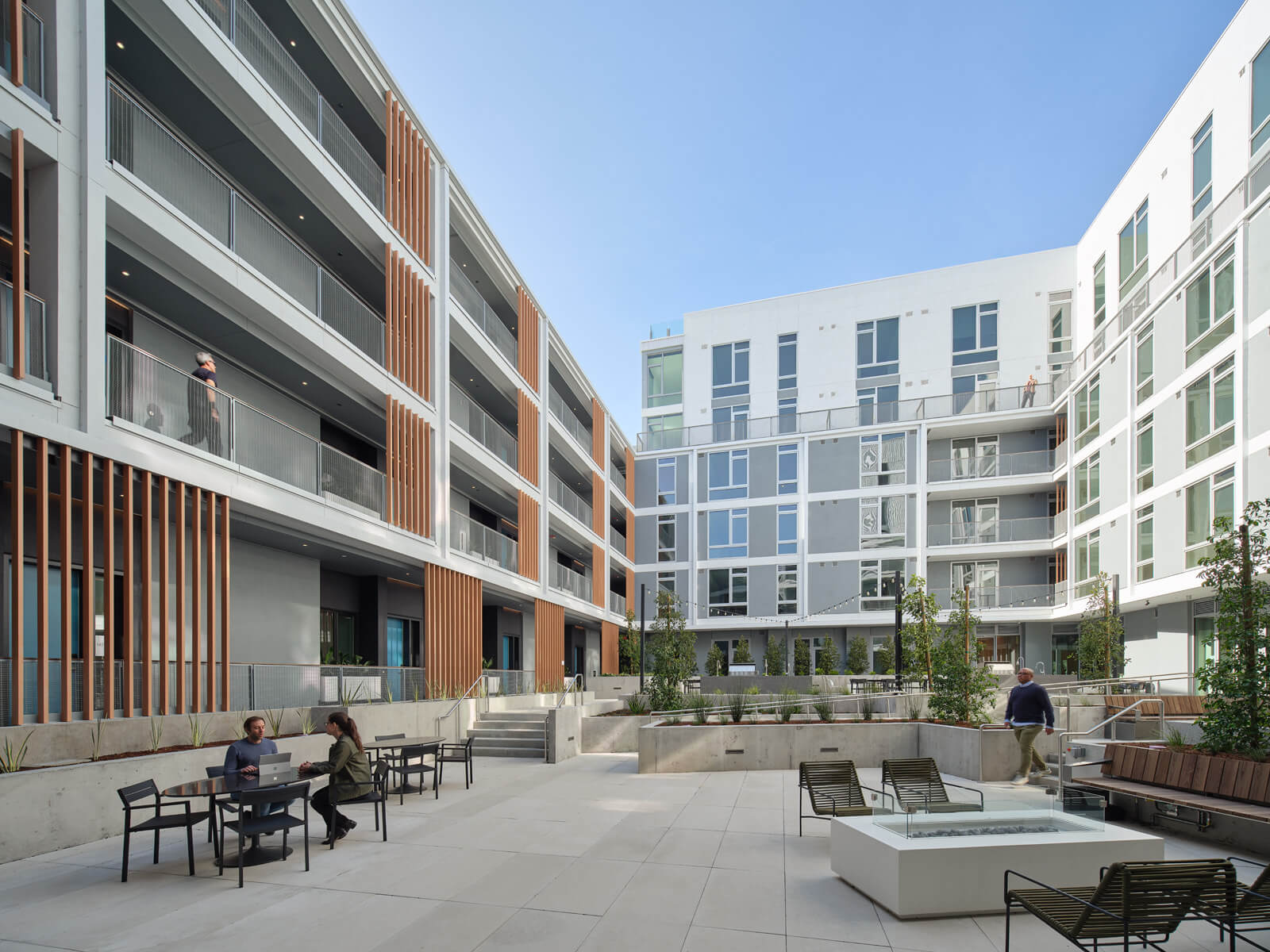 the courtyard at hawkins with apartment terraces looking down at it