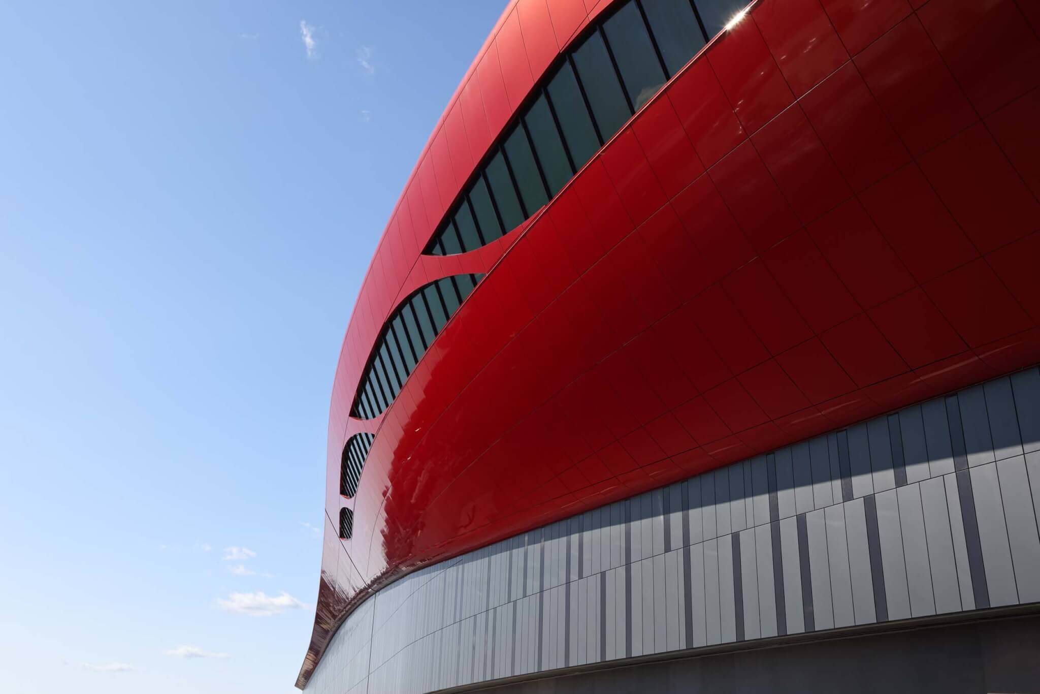 Red panels, airport, round form, leaf shaped windows, tapered ribbon windows