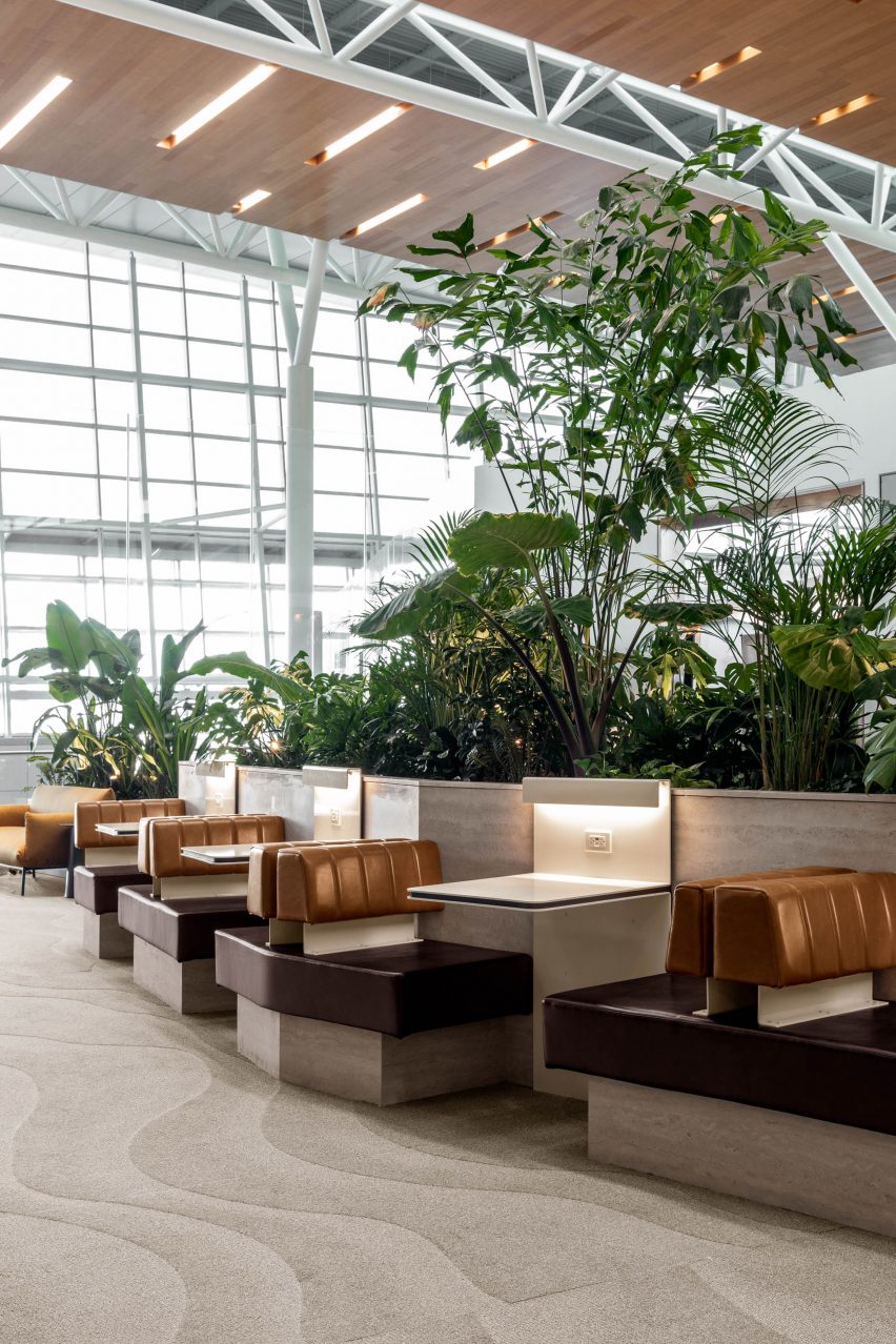 Steel tables cantilevered from planters