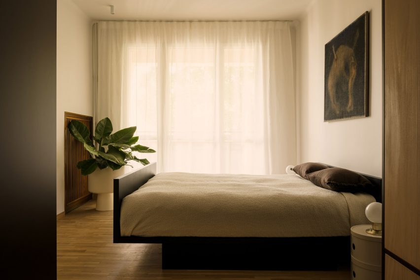 Neutral-hued bedroom in a mid-century apartment in Warsaw