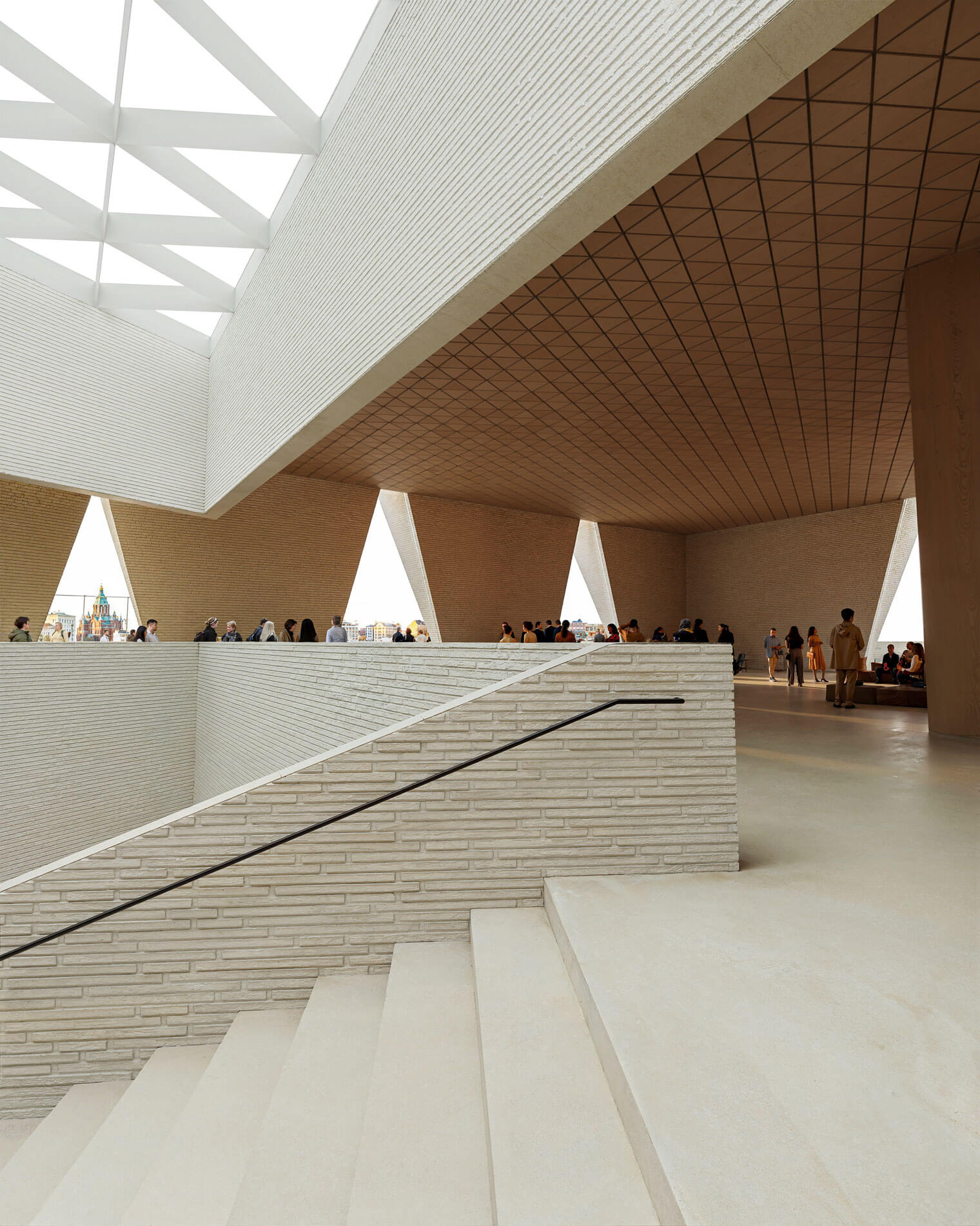 white brick wall on staircase and diagrid ceiling