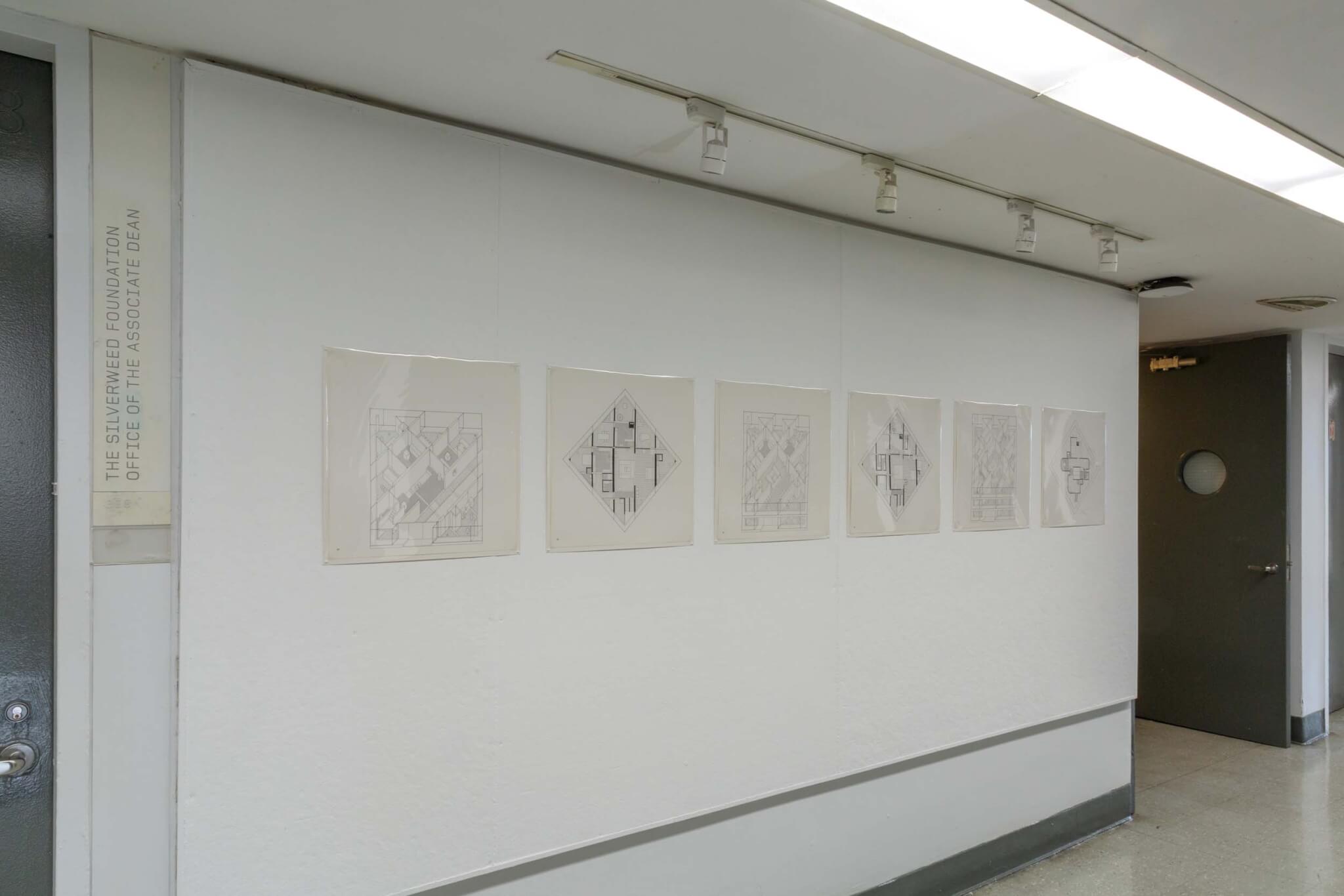 drawings by hejduk on wall in hallway