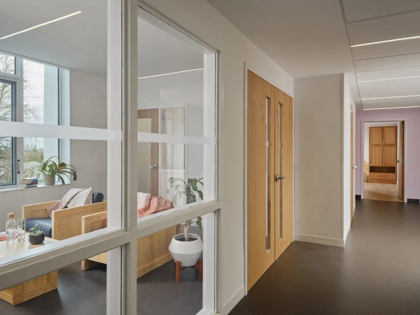 Corridor with a view into an intimate communal space