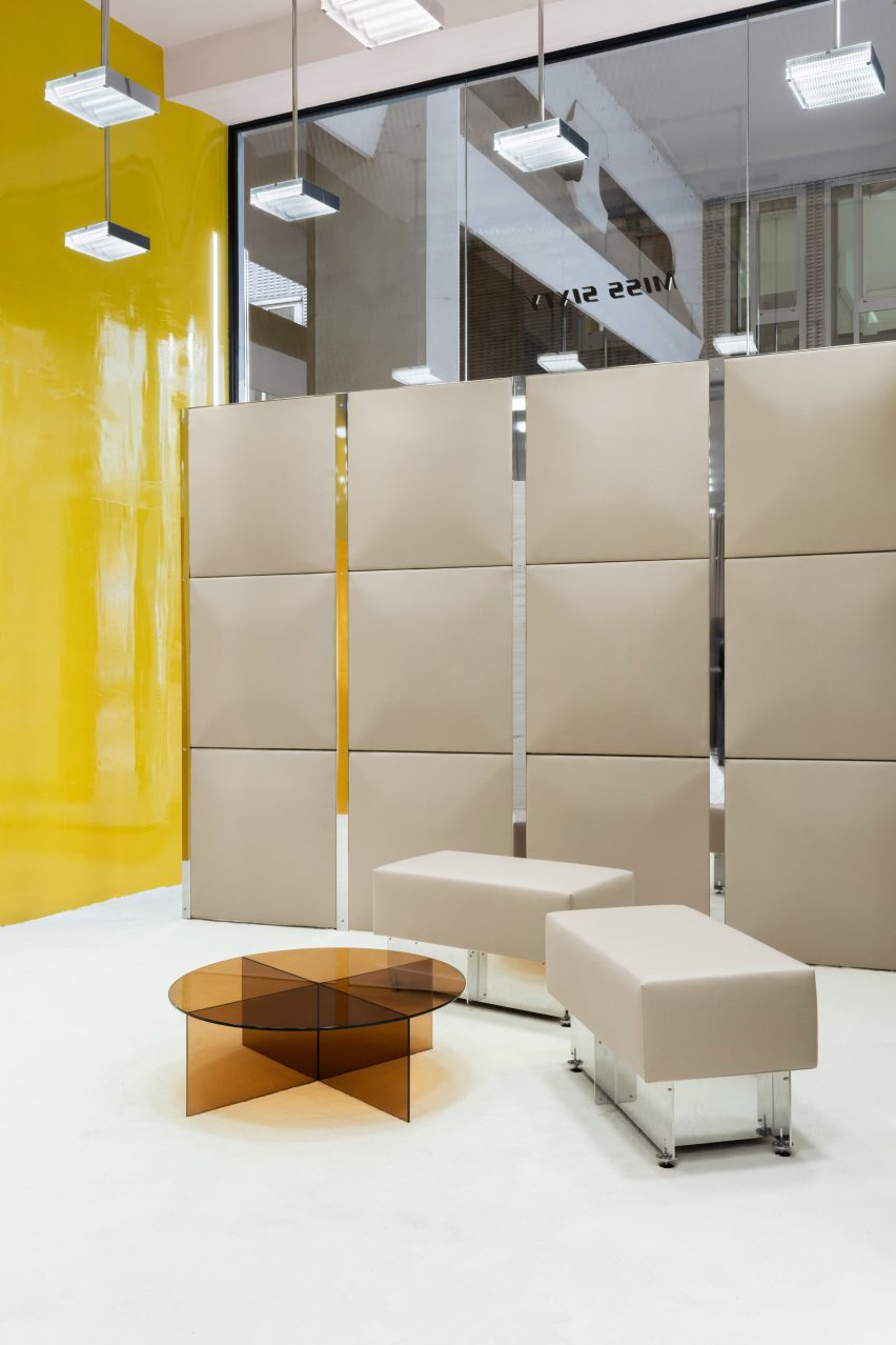 Bright yellow wall in fashion store