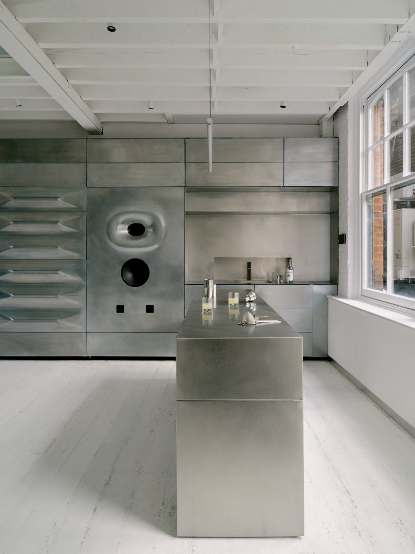 Reception desk next to metal sound wall