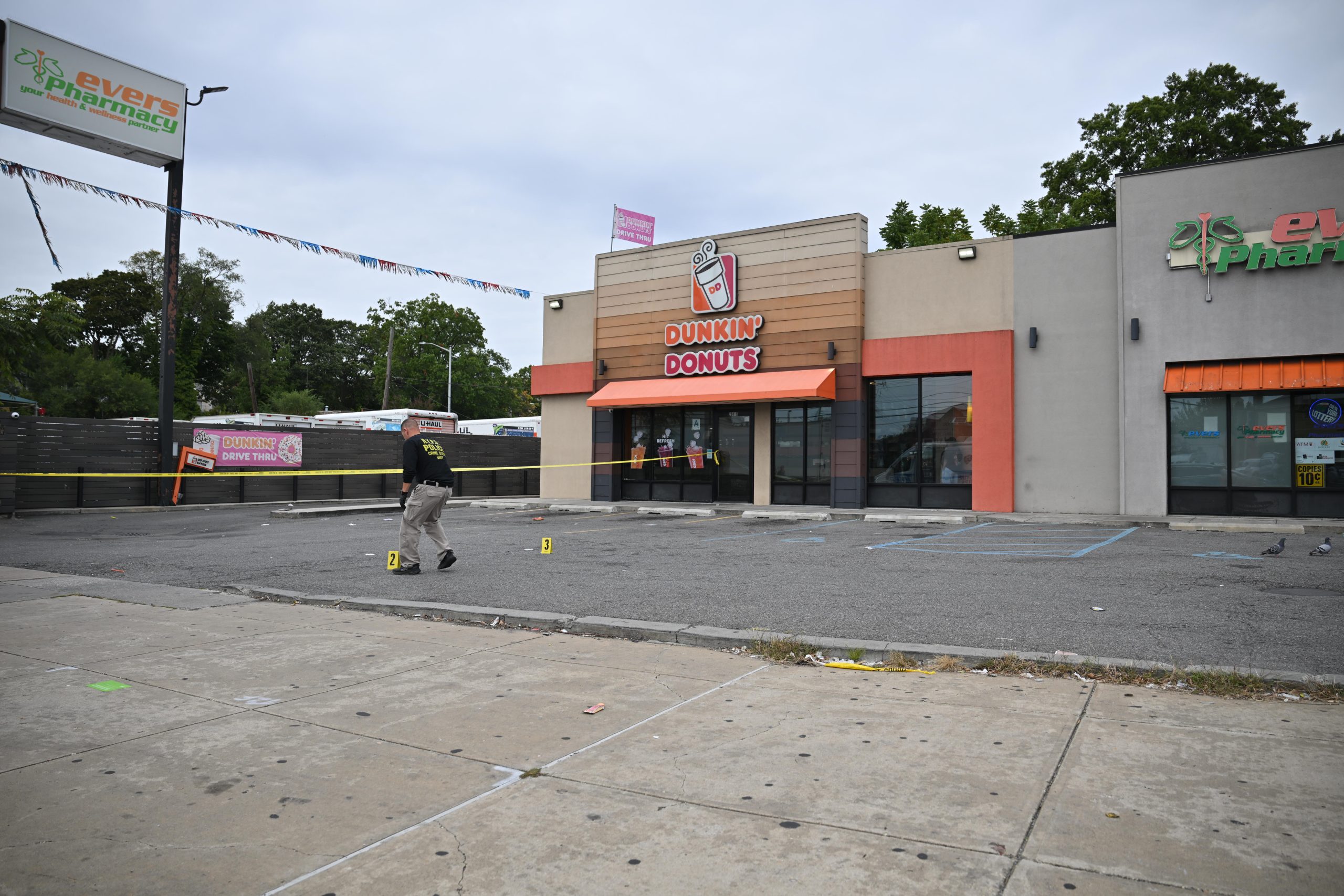 Police at the scene of the shooting at the Dunkin’ Donuts at 208-15 Linden Blvd. in Cambria Heights.