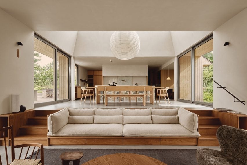 Living room with built-in sofa with steps either side