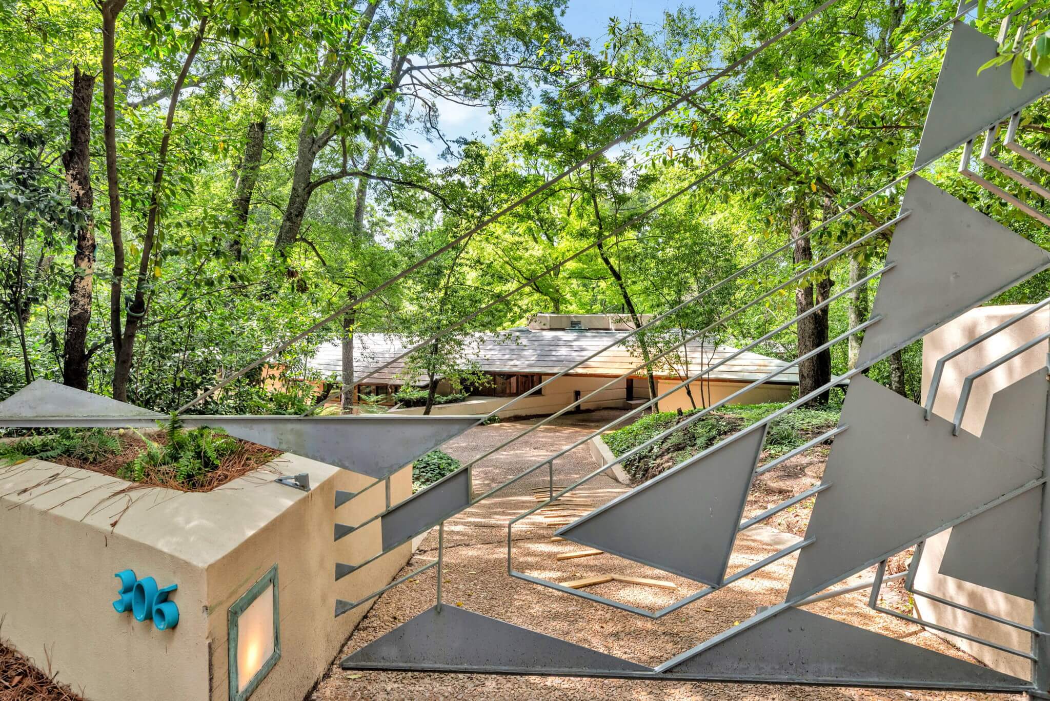 Exterior of house with geometric gate.