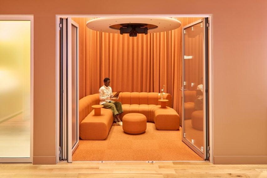 Completely orange room behind open folding doors