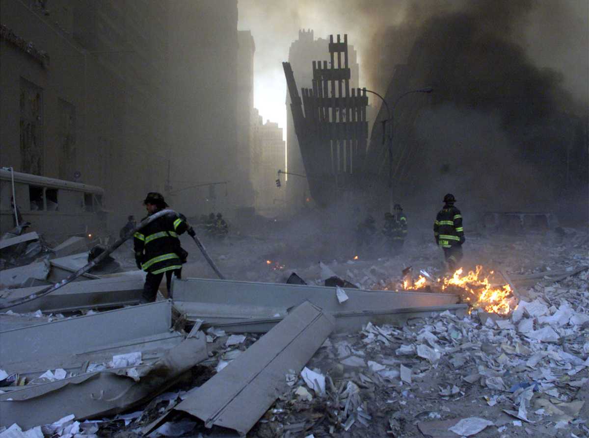 firefighters at the world trade center on 9/11 2001 after collapse