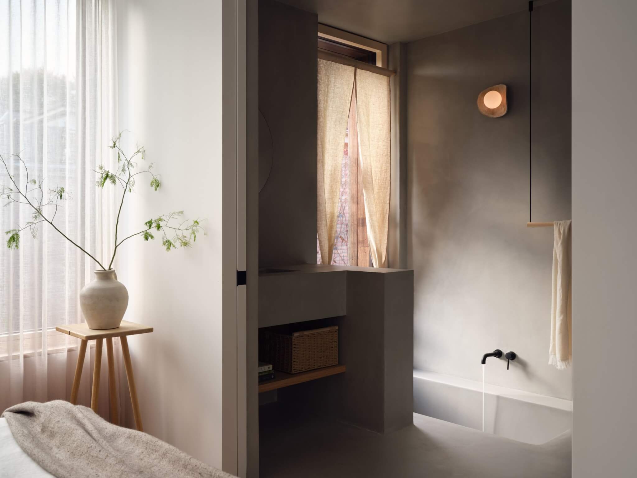 Interior view of bedroom into bathroom