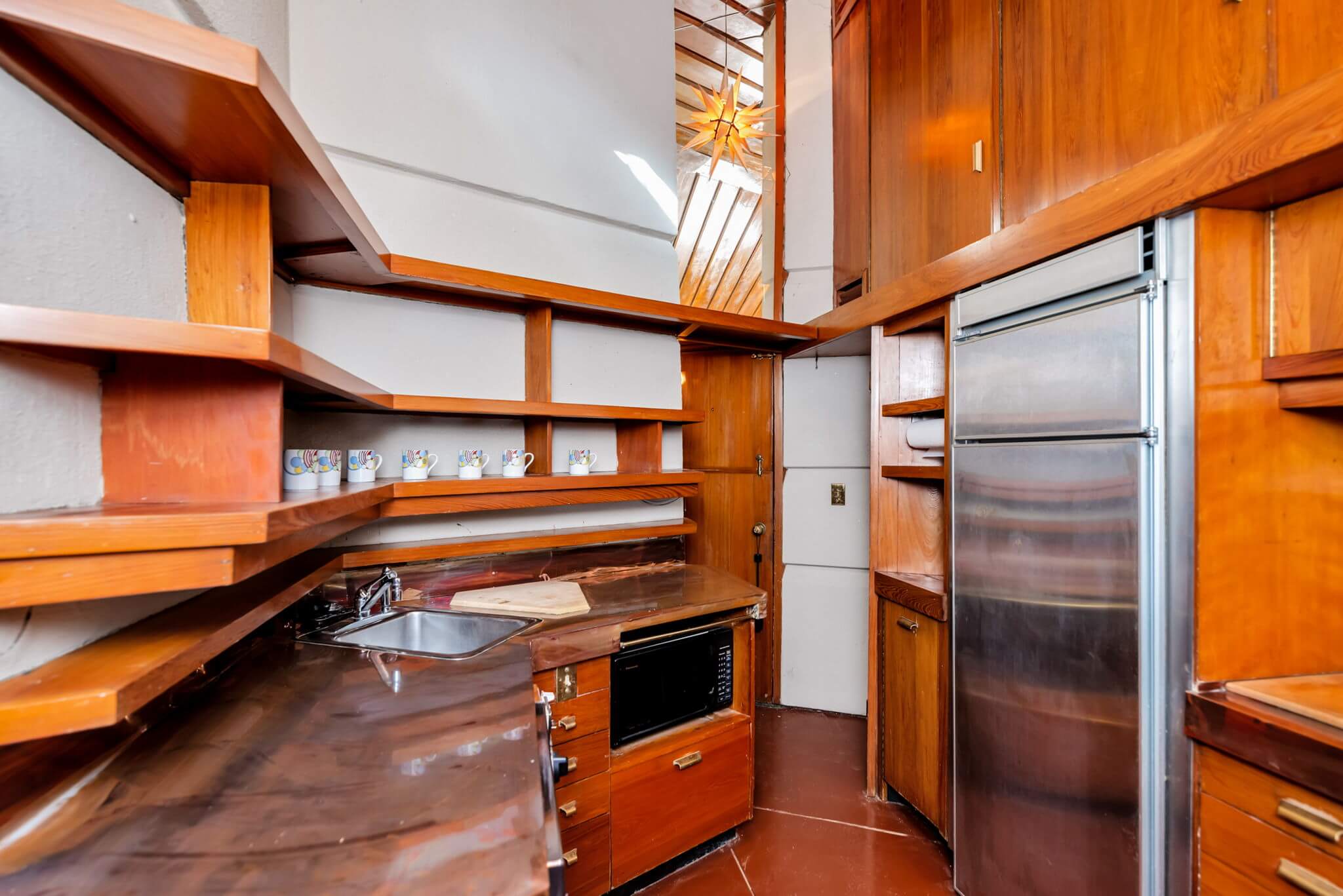 Interior view of kitchen made entirely out of wood.