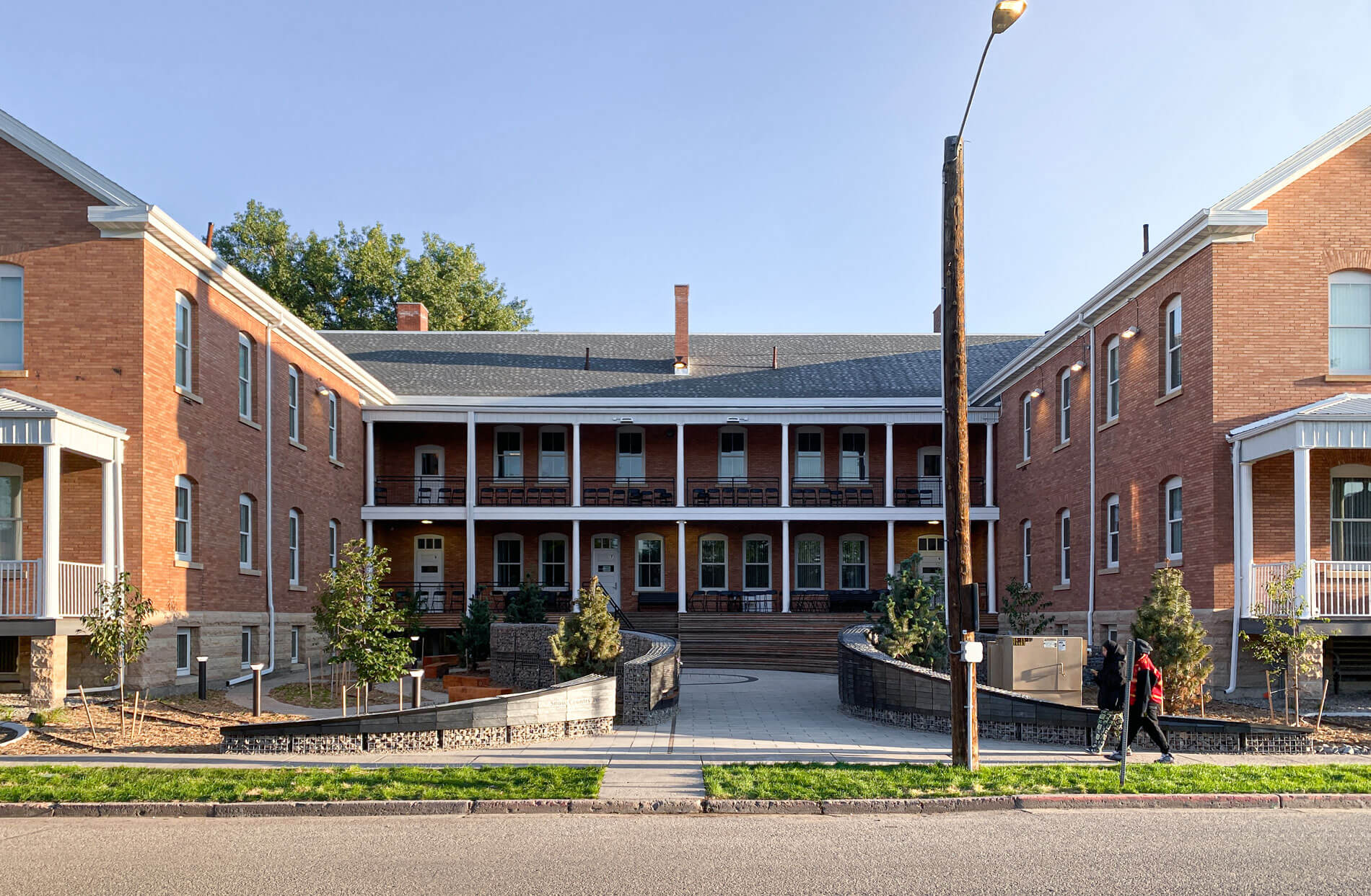view of snow country prison memorial in front of brick building