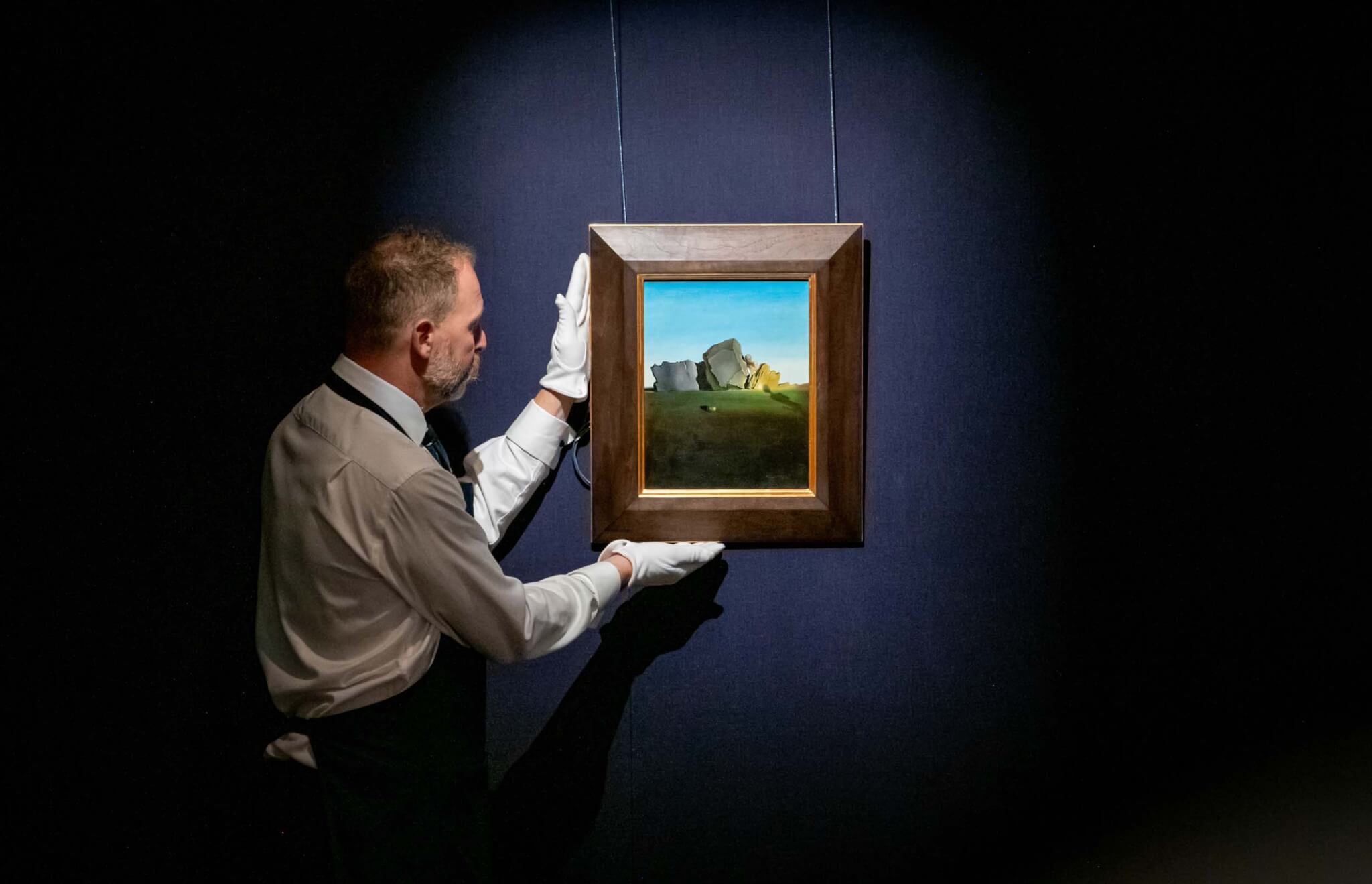 dalí on wall in sotheby's