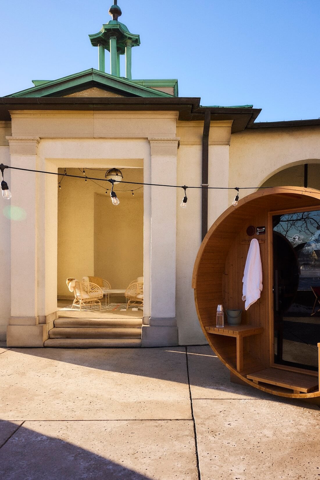 Sauna pod in front of building.