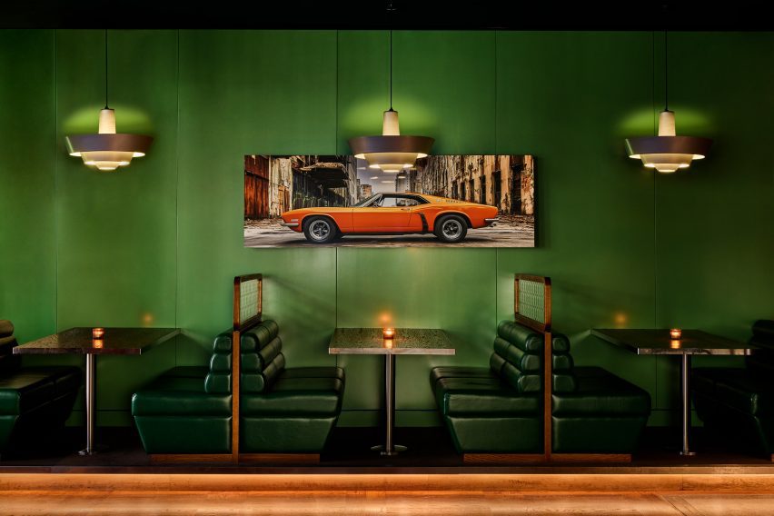 Green wall with picture of red car
