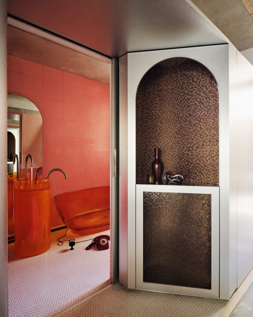 Orange kitchen with steel walls