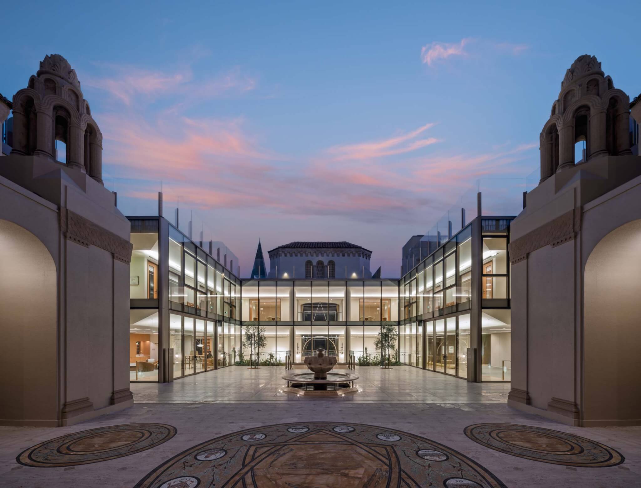 evening view of courtyard and glass addition