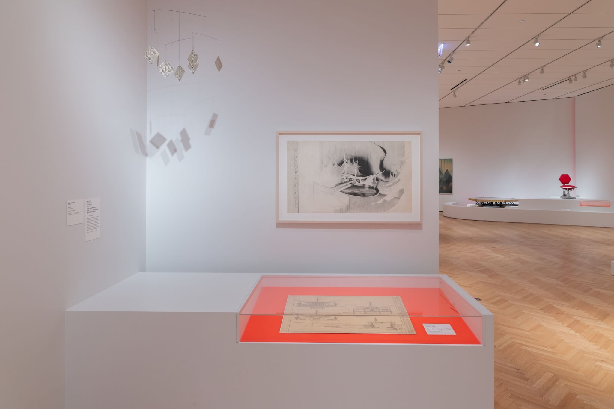 An installation view of Bruce Goff: Material Worlds exhibition features sketched drawings and mementos from Goff's personal archives.
