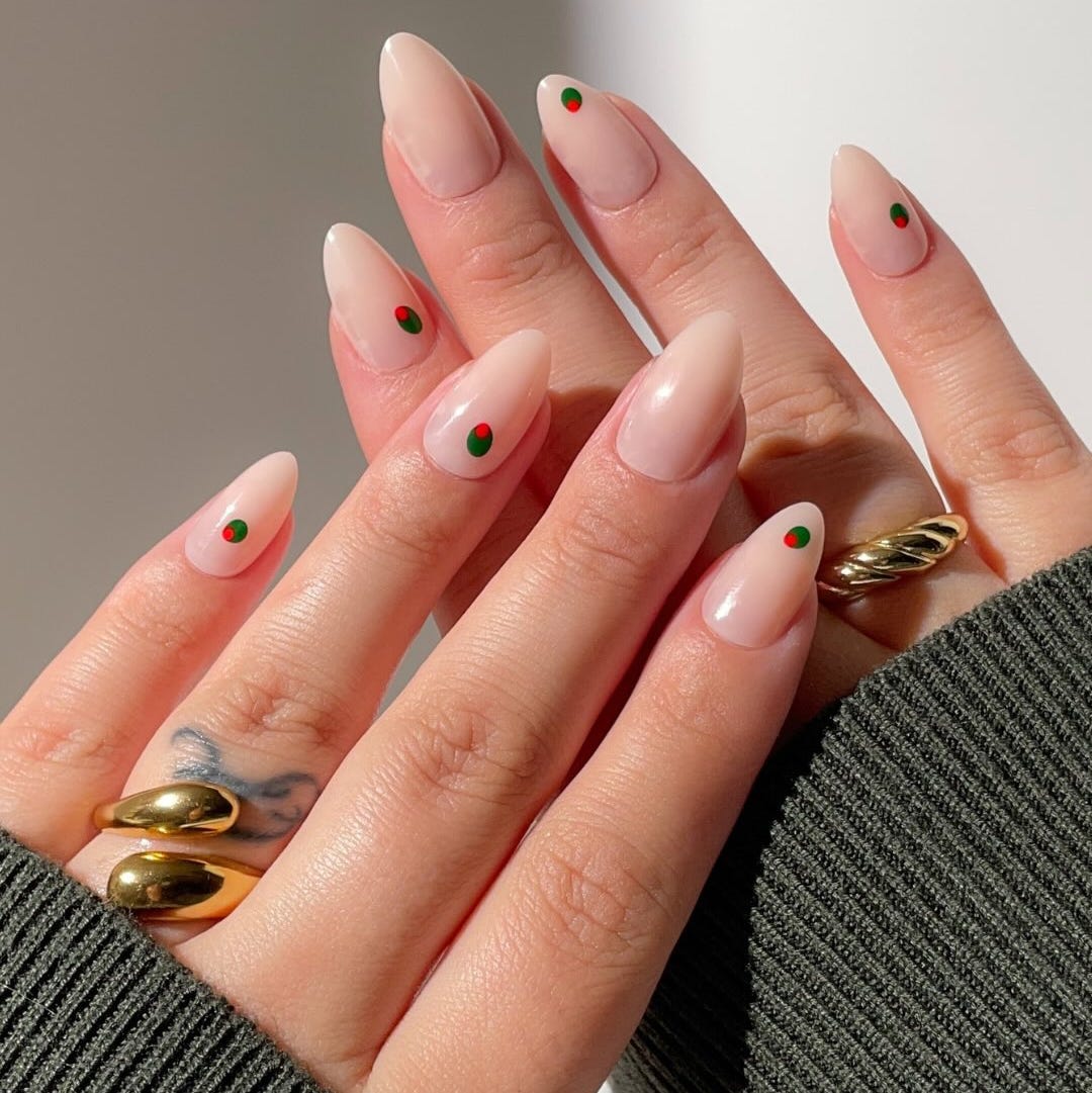 stylish nails with a nude polish and decorative dots