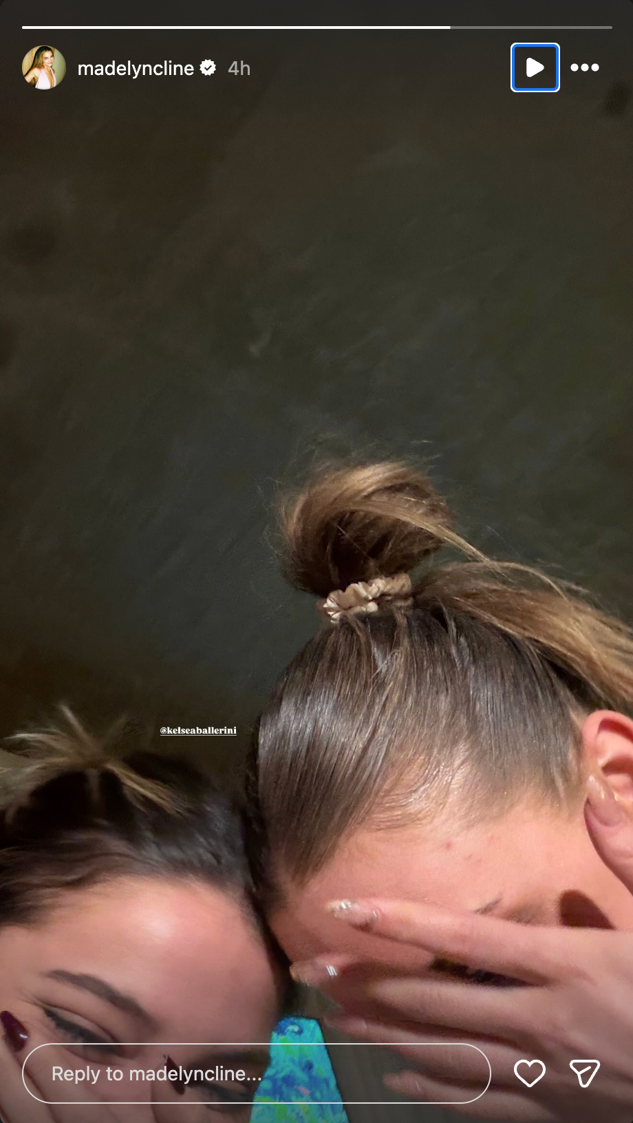 two individuals with hair tied up closeup shot