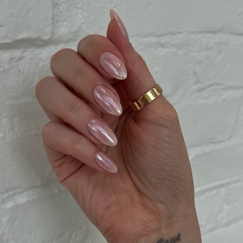 hand showcasing manicured nails and jewelry