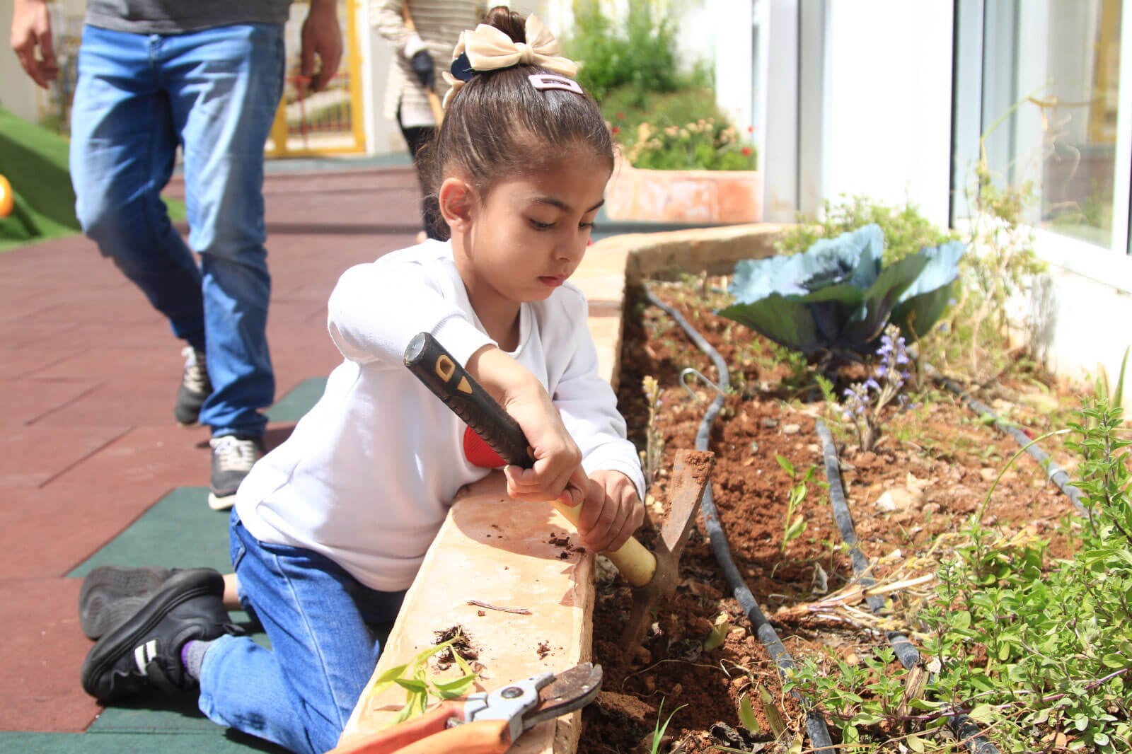 child using garden inside playground